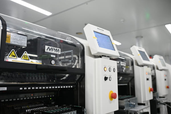 SMT machine working on automotive?PCB production line in clean?room factory, mass?producing automobile printed circuit boards