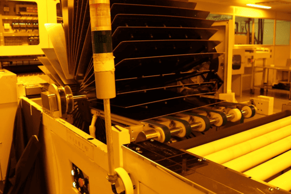 The machine is producing the inner-layer circuit patterns.