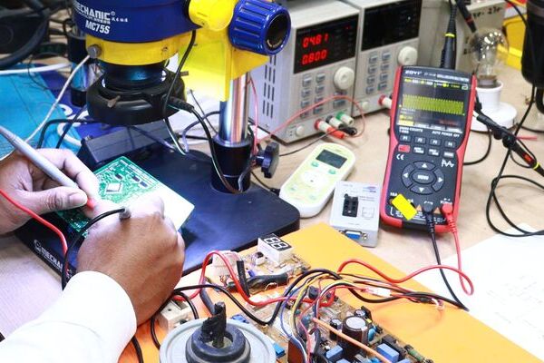 Testing electronic devices using digital multimeter (DMM)