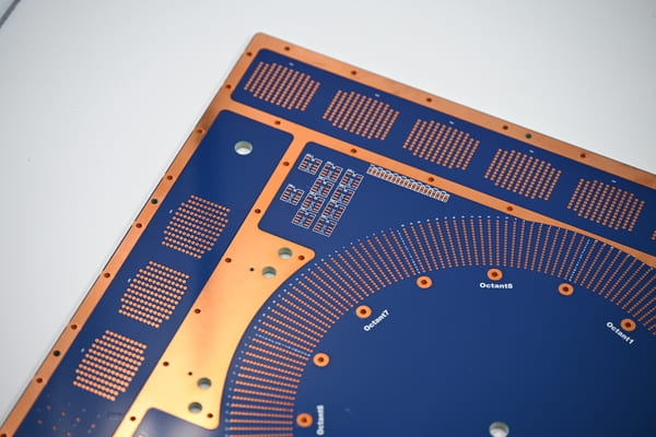 Large blue solder mask PCB with exposed copper thermal pads, drill holes, high-current circuit board