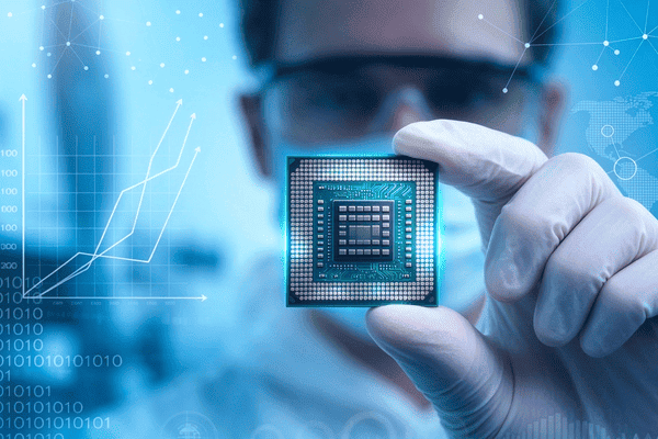 Engineer holding BGA semiconductor chip