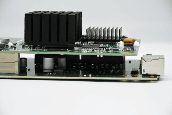 High density stacked PCBA with cooling heatsinks